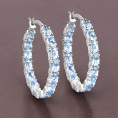 "Blue Topaz Earrings, Genuine Blue Topaz Earrings Sterling Silver, Blue Topaz Earrings for Women, December Birthstone Hoop Earrings for Her Stand out from the crowd with these glittering stylish earrings! Their unique shape and can't-be-missed coloring are the perfect way to make your outfit pop! Made of genuine oval blue topaz gemstones, these have a total weight of 5.70 carats. The earrings are made of rhodium plated .925 sterling silver. Product Details:  .925 Sterling Silver Item Type: Earri Blue Gemstone Hoop Earrings, Blue Hoop Earrings Fine Jewelry, Fine Jewelry Blue Hoop Earrings, Blue Topaz Earrings, Aquamarine Jewelry, Silver Gemstone Jewelry, Topaz Earrings, Stylish Earring, Jewelry Lookbook