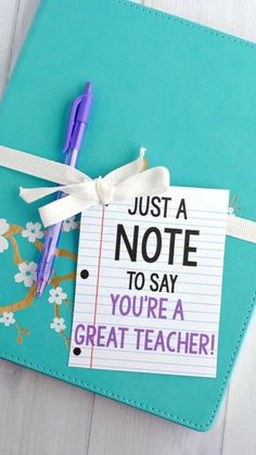 a notebook with a note attached to it that says, just a note to say you're a great teacher