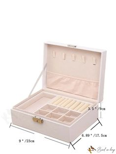 an open white box with compartments and dividers on the inside, showing measurements for each drawer