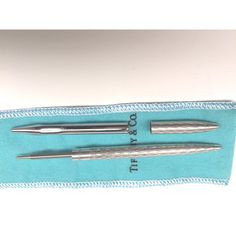 two surgical instruments are sitting in a case