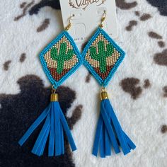 Cactus Beaded Statement Earrings With Tassel Suede Tassel Gold Detail New Blue Beaded Fringe Tassel Earrings For Festivals, Summer Blue Beaded Earrings With Tassels, Blue Beaded Fringe Tassel Earrings For Summer, Blue Beaded Tassel Earrings For Summer, Blue Southwestern Beaded Fringe Earrings, Southwestern Blue Beaded Fringe Earrings, Blue Beaded Fringe Earrings For Summer, Summer Blue Beaded Earrings With Fringe, Adjustable Blue Beaded Fringe Earrings