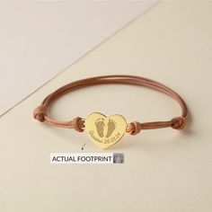 "This cute little baby bracelet is engraved with your baby's name and footprints. It can be personalized with your kid actual footprint (or a sample one) on the charm, along with his/her name, and an optional short message at the back Keep your baby close to you everyday. ► DETAILS * Dimensions: Heart charm measures approx. 3/4 x 5/8 inch (19 x 16mm) * Word limits: 5-7 words/side on the back. * The whole charm is solid .925 Sterling silver with PU leather chain. You can choose to plate (coat) the items with yellow gold or rose gold, free of charge. ► HOW TO PERSONALIZE 1) Select the leather color 2) Choose your finishing color (Silver, Gold or Rose) and engraving. 3) Add the item into your basket & check out as normal. 4) After your check out, please contact us through Etsy Conversation. * Adjustable Bracelet For Mother's Day Keepsake, Personalized Adjustable Heart Bracelet Gift, Adjustable Heart-shaped Engraved Name Bracelet, New Mom Jewelry, Baby Bracelet, Short Message, Mom Jewelry, New Mom, Baby Prints