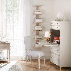 a white desk and chair in a room