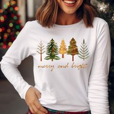 Welcome to Our Shop! Christmas Longsleeve Shirt,Merry and Bright,Christmas Tree shirt,Xmas Longsleeve Tshirt for Men,New Year Tee,Unisex T-shirt We offer a range of eco-friendly apparel, including Bella+Canvas unisex soft t-shirts, long sleeves, women's shirts, and V-neck shirts, Gildan sweatshirts & hoodies, Next Level tank tops for men and women, and 100% cotton baby bodysuits and long sleeve bodysuits from Gerber, Rabbit Skins, and LAT. Choose the perfect size, color, and design for you! Note White Long Sleeve Festive Shirt, Festive Long Sleeve T-shirt For Holiday, Festive Long Sleeve Holiday T-shirt, Winter Holiday Long Sleeve T-shirt, Holiday Long Sleeve Tops As Gifts, Holiday Long Sleeve Tops As A Gift, Festive Long Sleeve Christmas T-shirt, Festive Long Sleeve Cotton T-shirt, Long Sleeve T-shirt For Winter Holiday