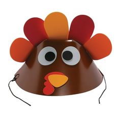 a paper turkey hat with googly eyes on it's head and ears is shown in front of a white background