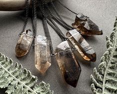 Smoky Quartz Necklace: Carry a piece of the earth with you wherever you go with this stunning raw crystal necklace! Simple and versatile, this little beauty is the perfect accessory for dressing up or down. ✧ Fair-trade Brazilian smoky quartz ✧ 100% natural raw crystal, not irradiated or heat treated ✧ Choose your favorite stone from the dropdown menu ✧ Crystal size 25-50mm (1-2 inches) ✧ Sleek gunmetal chain in your chosen length ✧ Hypoallergenic steel chain on request ✧ Sterling silver or blac Smoky Quartz Necklace, Alt Goth, Aesthetic Boho, Raw Crystal Jewelry, Raw Crystal Necklace, Quartz Crystal Pendant, Goth Aesthetic, Raw Crystal, Quartz Necklace