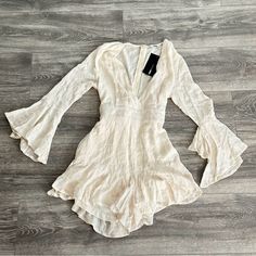 Ran Off White Romper Size Medium New Never Worn Tags Still Attached Fashion Nova Chic Long Sleeve Jumpsuits For Summer, Chic White Jumpsuits And Rompers For Spring, Chic Long Sleeve Summer Jumpsuits And Rompers, Chic Long Sleeve Jumpsuits And Rompers For Summer, Long Sleeve Jumpsuits And Rompers For Spring Brunch, Summer Long Sleeve Jumpsuits For Day Out, Fitted Long Sleeve Summer Jumpsuit, Fitted Long Sleeve Summer Jumpsuits And Rompers, Casual Cream Jumpsuits And Rompers For Spring