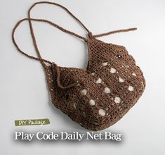 a crocheted purse is shown on a white background with the words play code daily net bag