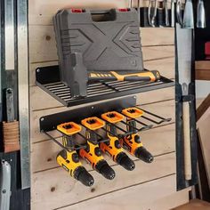 a tool rack with tools hanging on the wall