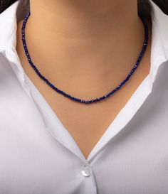 2mm blue lapiz beaded necklace. Wear it by itself or layered, day or night. Made in L.A. Blue Lapiz Beads: 2mm Length: 14- 16" adjustable Ships in 6-9 business days Rush order ships in 3-5 business days Comes gift ready in a custom Zoe Lev jewelry box Sapphire Colored Lapis Lazuli Single Strand Necklace, Sapphire Lapis Lazuli Jewelry With Faceted Details, Sapphire Single Strand Lapis Lazuli Jewelry, Sapphire Color Single Strand Lapis Lazuli Jewelry, Sapphire Single Strand Necklace In Lapis Lazuli, Sapphire Color Lapis Lazuli Necklace, Sapphire Beaded Rondelle Jewelry, Adjustable Single Strand Sapphire Necklace, Sapphire Single Strand Jewelry With Round Beads