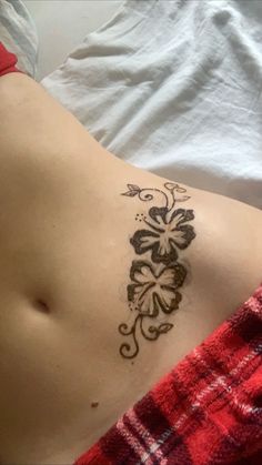 a woman with a tattoo on her stomach