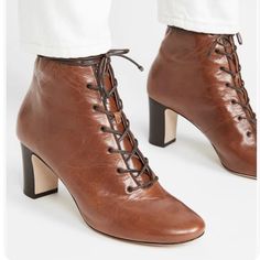 Tory Burch Vienna Lace-Up Ankle Bootie Cognac Brown Leather Boot Size Sz 6.5 New. Leather: Sheepskin Waxed Nappa Leather Grosgrain Trim Chunky Heel Lace-Up Closure Round Toe Leather Sole With Rubber Heel Cap Measurements Heel: 2.75in / 70mm Shaft: 4.75in / 12cm ** Floor Model. Marks/ Stickers On Sole** Designer Ankle Lace-up Boots For Fall, Designer Lace-up Ankle Boots For Fall, Lace-up Heeled Boots With Leather Sole For Fall, Fall Lace-up Heeled Boots With Leather Sole, Chic Lace-up Boots With Leather Sole, Elegant Lace-up Boots With Leather Sole For Spring, Brown Square-toe Leather Lace-up Boots, Spring Formal Boots With Laces, Leather Square Toe Booties For Spring