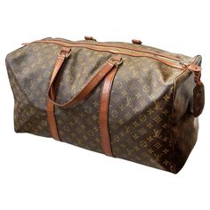 Vintage Louis Vuitton monogram luggage bag. The exterior of the bag is adorned with the renowned LV monogram pattern and vachetta leather details, finished with gold-tone brass hardware. Dimensions: 19"H x 24"W x 13"D Vintage Louis Vuitton Luggage, Lui Viton, Louis Vuitton Luggage, Monogram Luggage, Vintage Luggage, Monogram Pattern, Lv Monogram, Luggage Bag, Vintage Louis Vuitton