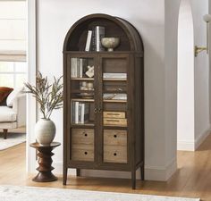 a tall bookcase with many books in it