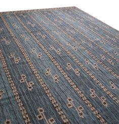 a blue rug with an intricate design on it