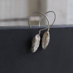 Nature earrings -Sterling silver dangle earrings -Cardamom earrings-Botanical jewelry -Nature jewelry -Gift for her -Gift for chef or cooks Sterling silver cardamom pod earrings nature cast from a real cardamom using the lost wax method. The cardamom soldered in Sterling silver wire hook and has matte finish. Material: Sterling silver Cardamom pod size : 2cm Total length:4cm Please note that every piece you purchase from cyklu is unique and handmade by me. You can make it yours or turn it into g Single Earring Nature-inspired Jewelry As Gift, Nature-inspired Single Earring As A Gift, Nature-inspired Single Earring As Gift, Silver Nature-inspired Hoop Earrings As Gift, Silver Nature-inspired Hoop Earrings For Gift, Nature-inspired Sterling Silver Pierced Earrings, Silver Drop Earrings With Nature-inspired Style, Nature-inspired Silver Drop Earrings, Silver Nature-inspired Drop Earrings