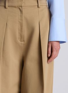 The Ryder Pant is crafted from our structured cotton twill in an autumn khaki hue. This voluminous wide-leg silhouette features front pleat detailing, side slash pockets and back welt pockets with a high rise fit. Shop Bottoms. Styling Tip: Balance the voluminous leg silhouette with a slim top or cropped shirt. Khaki High-waisted Chinos For Work, High-waisted Khaki Chinos For Work, Khaki Wide Leg Workwear Pants With Belt Loops, Khaki Wide Leg Pants For Work With Belt Loops, Wide Leg Khaki Chinos For Work, Wide-leg Khaki Chinos For Workwear, Black Quilted Jacket, Wide Leg Pant, Denim Jumpsuit