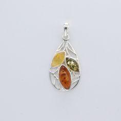 These is a beautiful Sterling Silver Pendant with Amber from Gdansk, Poland. The pendant is made out of solid 925 Silver and there is no nickel or other substances causing most allergies. This makes the pendant hypo allergenic. Size of the Pendant in total - with the bail 3.8 x 1.7 cm or  1.50 x 0.67 inch Please note: Our jewelry is photographed close up to show detail and may appear larger than they are. We are happy to help with any questions. You will receive the item in a gift box - perfect Silver Teardrop Gemstones, Silver Teardrop Gemstones For Anniversary, Silver Multi-stone Pear-shaped Jewelry, Silver Pear-shaped Multi-stone Jewelry, Pear-shaped Multi-stone Silver Jewelry, Gdansk Poland, Amber Ring, Gdansk, Teardrop Pendant