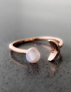 Sun and Moon Ring | Channel the power of the moon with this authentic moonstone ring. Handcrafted in 14K rose gold over sterling silver. It features an open shank sun & moon ring design and will be a wonderful addition to your ring collection. A luminous rainbow moonstone symbolizes inner growth and strength. Wear it to promote inspiration, intuition and empathy.