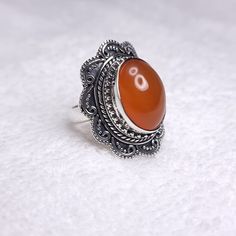 In contemporary times, carnelian is thought by some to enhance self-esteem and creativity, to combat feelings of inadequacy, to increase physical energy and overcome insomnia. In the home, carnelian is believed to increase motivation towards action. Gemlogica is an American business and our motive is to create an honest and transparent company. We do not misrepresent our items and we strictly use ethically mined NATURAL gemstones and precious metals like sterling silver and gold. (we do not use Silver Carnelian Rings Spiritual Style, Silver Carnelian Spiritual Ring, Silver Carnelian Ring, Spiritual Carnelian Cabochon Rings, Increase Motivation, Gift For Fiance, Clean Sterling Silver, Carnelian Ring, Gifts For Fiance