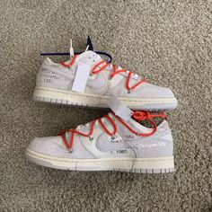 ***Purchased From Snkrs*** This Off-White X Nike Dunk Low Is Taken From The ‘Dear Summer’ Collection, A Sprawling Follow-Up To Virgil Abloh’s First Nike Dunk Collaboration From 2019. The Low-Top Makes Use Of A White Leather Upper With Soft Grey Suede Overlays, Along With Virgil Abloh’s Calling-Card Flourishes, Which Include A Plastic Zip Tie And Printed Helvetica Text. Contrasting Pops Of Color Arrive Via The Sneaker’s Secondary Lacing System, Zip-Tie, An Exposed-Foam Tongue And A Rectangular Ta Off White Sneakers For Streetwear, Nike Custom White Sneakers With Vulcanized Sole, Nike Off White Sneakers With Round Toe, Nike Low-top Sneakers With White Laces, Nike Off White Low-top Sneakers, Off White X Nike, Calling Card, Zip Ties, Grey Suede