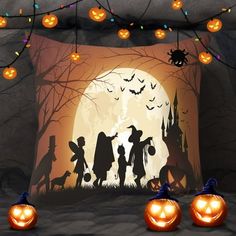 halloween scene with pumpkins, jack - o'- lanterns and children in silhouette