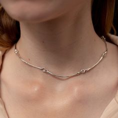 Everything but ordinary, this articulated eye-catcher is a modern and delicate take on the classic choker. Its light bone-shaped bars are connected with rings, making it comfortable to wear at all times. It can be worn alone or stacked with its vermeil or silver twin. Its versatility makes it easy to layer with all necklaces from the Hope collection. Made in sterling silver. 925 Sterling Silver, High Polished Finish, Nickel-free, Handmade, Engraved with Mara Paris logo Mara Paris, Rings Making, Dance Earrings, Paris Jewelry, Paris Logo, Chocker Necklace, Ear Cuff Earings, Silver Choker, Continuous Line