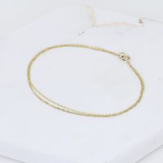 "14K Gold Dainty Double Chain Bracelet - 14K Solid Gold Bracelet ★ The chains and all components are 14K solid yellow gold The length includes the chain and the closure. Please measure your wrist before you place your order. ** How to choose a correct size of bracelet. 1. Measure your wrist below the wrist bone using a flexible tape measures, a string or a strip of paper. 2. If using a string or a strip of paper, mark length. Then, measure it with a ruler. 3. To find the bracelet size, add 1/2\" Tarnish Resistant Recycled Yellow Gold Bracelet, Delicate Chain Yellow Gold-plated Bracelet, Yellow Gold Recycled Gold Bracelet As A Gift, Yellow Gold Recycled Gold Bracelet For Gift, Gift Yellow Gold Bracelet In Recycled Gold, Yellow Gold-plated Bracelet With Delicate Chain, Delicate 14k Yellow Gold Chain Bracelet, Delicate Yellow Gold-plated Chain Bracelet, Minimalist 14k Gold Double Chain Jewelry