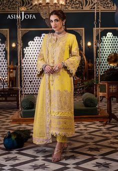 Shirt: Lawn By Pcs: 3 Pcs Trouser: Cambric Dupatta: Chiffon Color: Yellow Product Details Shine bright like the sun in this gleaming yellow ensemble adorned with antique gold zari work and radiant 3mm sequins. Like beams of sunshine, the dull beige threadwork adds warmth and depth to the fabric. With embroidered panels and back, this ensemble captures the essence of a sunny day. The embroidered border for the daman and sleeves with borders glisten with sophistication while the embroidered motifs Yellow Pakistani Suits, Pakistani Dresses Party, Mehndi Outfits, Pakistani Boutique, Pakistani Designer Clothes, Asim Jofa, Chiffon Collection, Embroidered Border, Modest Wear