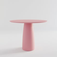 a pink round table on a white background