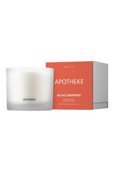 apothheke sea salt and grapefruit candle in front of a box