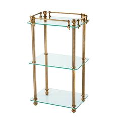 three tiered glass shelf with brass fixtures