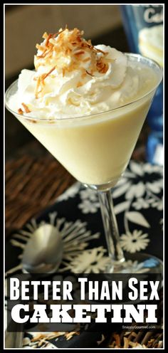 a martini with whipped cream and toasted coconut on top