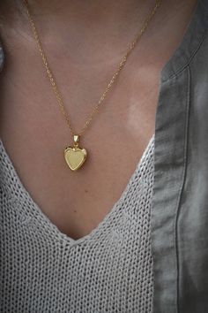 18-karat gold plated heart locket hangs on a sturdy 18-karat gold plated stainless steel chain.  Choose your chain length from the drop-down menu.   This locket is perfect for using as a keepsake necklace and is a thoughtful gift for someone special in your life. You can choose the locket as is, without photos, or have it personalized with your photo (s) and engraved your birth flower. You choose your options at checkout.  A mock-up of the photo will be done for your approval. Once approved, I w Dainty Heart Pendant Locket Jewelry, Elegant Double Heart Charm Necklaces For Keepsake, Elegant Double Heart Charm Necklace Keepsake, Elegant Heart-shaped Locket Charm Necklace, Elegant Heart Locket Charm Necklace, Elegant Heart Shaped Locket Charm Necklace, Dainty Double Heart Locket Necklace, Elegant Double Heart Locket Charm Necklaces, Heart Pendant Locket Charm Necklace For Keepsake