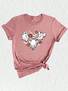 Introducing our Ghost Heart Shirt, the perfect addition to your spooky season wardrobe! This Halloween-inspired t-shirt features a captivating design that combines the ghostly elements of the season with a touch of cuteness. Get into the Halloween spirit with this Scary Ghost Shirt, which features a friendly ghost, hearts, and all the elements of a fun and memorable Halloween night. The vibrant colors and playful design make it a must-have for the Halloween party or as a Halloween gift for your Trendy Halloween Short Sleeve T-shirt, Spooky Short Sleeve T-shirt For Fall, Spooky Cartoon Print T-shirt For Fall, Fall Spooky Cartoon Print T-shirt, Trendy Cotton Halloween Tops, Trendy Halloween T-shirt With Cartoon Print, Halloween Trendy Crew Neck Top, Casual Halloween Shirt With Cartoon Print, Trendy Cotton Tops For Halloween