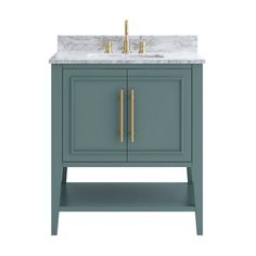 a bathroom vanity with marble top and two gold faucets on the sink area