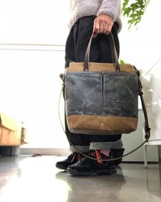 Tote bag in American heavy weight waxed canvas. The color is sage for the body, the magazine pocket that runs over the bottom for extra durability is made in heavy weight waxed canvas in also in sage, with a double outside pocket on the other side in medium weight black waxed canvas in grey. I made it into an everyday bag perfect for the office, with leather handles, shoulder strap, and 3 outside pockets Closing with a zipper on top. Including a leather shoulder strap, adjustable and detachable. Everyday Waxed Canvas Shoulder Bag With Top Carry Handle, Everyday Waxed Canvas Shoulder Bag With Top Handle, Coated Canvas Tote Shoulder Bag With Waxed Finish, Waxed Canvas Tote Bag With Top Carry Handle, Canvas Bags With Top Carry Handle For Outdoor, Canvas Satchel With Top Carry Handle For Everyday Use, Everyday Canvas Shoulder Bag With Top Carry Handle, Everyday Canvas Satchel With Top Carry Handle, Outdoor Canvas Shoulder Bag Briefcase