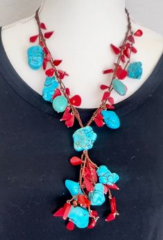 Hathor goddess vibes are coming at you with this bold turquoise and coral necklace crafted by Egyptian artisans. This piece is one-of-a-kind! This necklace is 54 cm around the neck and 13 cm from the large middle turquoise pendant to the bottom. It weighs 161.5 grams. Unique Turquoise Necklace With Natural Stones For Festivals, Bohemian Turquoise Necklace With Unique Variations, Handmade Turquoise Lariat Necklace, Unique Turquoise Lariat Necklace, Bohemian Turquoise Necklace With Red Coral, Bohemian Jewelry With Natural Stones And Red Coral, Bohemian Red Coral And Turquoise Jewelry, Bohemian Red Coral Jewelry With Natural Stones, Bohemian Beaded Necklaces With Red Coral