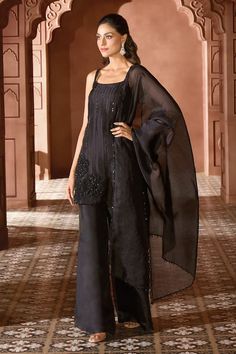 Black straight short kurta with tonal linear pattern and big floral applique embroidery. Comes with solid sharara and scalloped embroidered border dupatta. - Aza Fashions Elegant Black Salwar Kameez For Reception, Black Organza Sharara For Diwali, Elegant Black Sharara With Sheer Dupatta, Black Organza Sharara With Dupatta, Elegant Black Unstitched Suit For Reception, Black Silk Dupatta For Reception, Elegant Black Palazzo Set With Sheer Dupatta, Elegant Black Palazzo Set With Mirror Work, Black Fitted Organza Sharara