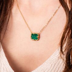 This pendant features a petite rectangular Emerald, with beautiful facets. This vibrant, one-of-a-kind stone is set in our signature handmade gold bezel pendant with braided detail and suspended from a matching gold chain. One of a Kind. Technical Details Metal: 18k yellow goldEmerald: 5.21 cts. Pendant Size: 10 x 12mmChain: can be worn at 16" and 18"Closure: lobster claspHandmade in New YorkStyle # N-3162-EM Luxury Emerald Gemstone Necklace With Rectangular Pendant, Luxury Emerald Necklace With Rectangular Pendant For Formal Occasions, Luxury Gold Emerald Necklace With Natural Stones, Luxury Pendant Emerald Necklace For May Birthstone, Luxury Gold Briolette Emerald Necklace, Luxury Oval Emerald Necklace With Natural Stones, Luxury Oval Emerald Birthstone Necklace, Luxury Briolette Emerald Necklace, Luxury Square Pendant Emerald Necklace