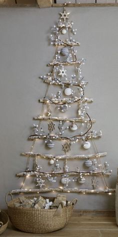 a white christmas tree with ornaments on it