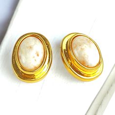 Nice chic pair of cream beige Agate oval cabochon clip on earrings.  These beautiful Agate stoness are beautifully polished and set in a luxurious yellow gold plated frame.  The earrings measure 7/8 inch long X 5/8 inch wide. In excellent condition Please be sure to look closely at all pictures as I do try to capture the items condition so that you may see any marks or flaws and make an informed decision. All items Shipped from my shop will be tracked and insured for both your peace of mind and Luxury Gold Cabochon Clip-on Earrings, Luxury Vintage Cabochon Clip-on Earrings, Luxury Vintage Cabochon Earrings, Cream Beige, Oval Cabochon, Clip On, Clip On Earrings, To Look, Etsy Earrings