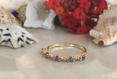 Don't miss this opportunity to own this beautiful gemstone ring crafted in 14k gold filled You can wear the rings as a set together or each ring by it self. => Gemstone Type - Amethyst => Gemstone Size - 2.25mm => Gemstone Cut - Faceted => Gemstone Shape - Round Shape => Total Number of Gemstones - 5 => Metal Type - 14k Gold Filled (Tarnish Resistant And Nickel Free) - also available in 925 sterling silver * Please contact me for pricing on a sizes larger than 11 * ~ Feel free Dainty Rings With Accent Stones For Promise, 14k Gold Crystal Ring With Accent Stones For Anniversary, 14k Gold Amethyst Ring For Promise, Yellow Gold Cluster Ring With Accent Stones For Promise, 14k Gold Amethyst Ring With Center Stone For Promise, 14k Gold Birthstone Promise Ring With Vs Clarity, Gold Amethyst Stackable Rings, Amethyst Crystal Ring In Yellow Gold For Promise, Yellow Gold Amethyst Crystal Ring For Promise