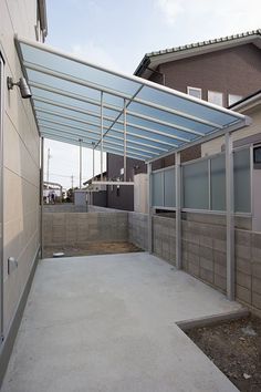 an empty patio with a metal roof over it