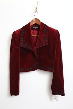 Elevate your style with this stunning Rare New J. Peterman velvet bolero jacket. The rich red color and intricate embroidered accents make it perfect for any occasion, from casual to formal. The long sleeves and collared neckline provide added warmth during the fall and winter seasons. This vintage piece is made with high-quality cotton velvet and lined with acetate for a comfortable fit. The short jacket length and solid pattern give it a classic, preppy vibe that is perfect for city or travel wear. Whether you're looking for a statement piece for a party or cocktail event, or simply want to add some designer flair to your workwear, this bolero jacket is sure to impress. Red And Gold Clothes, Drummer Oc, Jackets Aesthetic, Velvet Jacket Outfit, Velvet Jacket Women, Velvet Bolero, Red Velvet Jacket, J Peterman, Statement Jacket