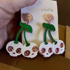 Fun Earrings That Look Like Cherry Skulls. Great For Halloween Or Anytime You Feel Sweet And Spooky. Sparkly Green Stems And Pink Sparkly Skull Eyes. Lightweight Hard Vinyl. White Halloween Party Jewelry, White Novelty Jewelry For Party, Novelty White Jewelry For Party, White Novelty Party Jewelry, Fun White Jewelry For Halloween, Fun White Halloween Jewelry, Halloween Skull Jewelry In White, White Skull Jewelry For Halloween, White Skull-shaped Halloween Jewelry