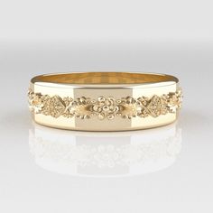 This is a completely original floral design, vintage style ring inspired by the Victorian style. With its intricate details, it is perfect for those who opt for understated elegance. This is the groom's version of our bestseller Victorian ring and makes a perfect wedding band! CUSTOMIZATION * This band is fully customizable with any text you would like on the inside, at no extra cost (up to 20 characters!) * We use Bodoni Sans Bold as the font for inside ring engravings. * It can also be made in Victorian Engraved Ring With Decorative Band For Anniversary, Victorian Signet Ring For Wedding With Intricate Design, Victorian Wedding Signet Ring With Intricate Design, Ornate Formal Rings With Decorative Band, Heirloom Wedding Signet Ring With Intricate Design, Engraved Wedding Ring With Historical Design, Classic Filigree Ring With Decorative Band For Anniversary, Classic Wedding Signet Ring With Intricate Design, Yellow Gold Historical Design Anniversary Rings