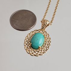 Elevate Your Style with Our Oval Filigree Turquoise Pendant Necklace 🌟Unleash your inner fashionista with our exquisite Oval Filigree Turquoise Pendant Necklace, a versatile accessory that effortlessly combines elegance and charm. Crafted with precision and passion, this necklace is designed to make a statement.The pendant's oval shape boasts an intricate filigree design that radiates sophistication and timeless beauty. Each delicate detail speaks volumes about the craftsmanship that went into Elegant Turquoise Cabochon Pendant Necklace, Elegant Turquoise Cabochon Necklace, Elegant Turquoise Oval Pendant Jewelry, Elegant Turquoise Necklace With Round Pendant, Elegant Gold Turquoise Necklace With Oval Pendant, Elegant Oval Turquoise Necklace As Gift, Elegant Oval Turquoise Necklace For Gift, Elegant Oval Turquoise Necklace Gift, Turquoise Gemstone Oval Pendant Jewelry