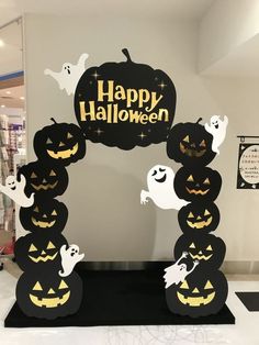 a halloween display with pumpkins and ghostes