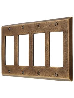 a metal switch plate with three plates on each side